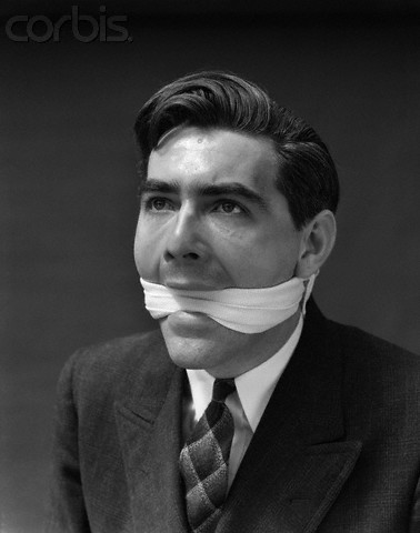 1930s Portrait Of Man With Gag In Mouth